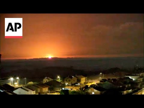 Explosions light up the night sky over Gaza Strip