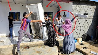 Buying a refrigerator for Pari's family by videographer.  Jealousy of Mirza Ali