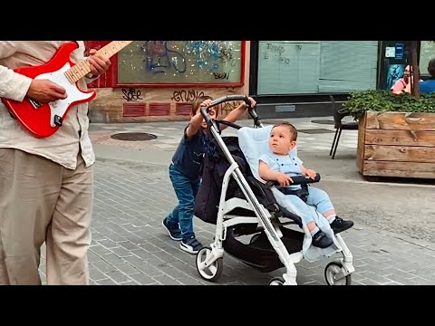 Following this kids with my guitar! Funny reaction