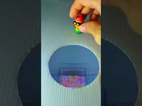 ASMR Minion jumps into colorful beads 01