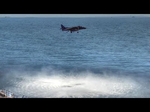 Harrier Jump Jet Performs Vertical Takeoff And Landing On Ship