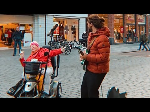 Grooving from her Wheelchair with Street Performer