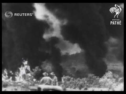 JAP AIR RAID ON NEW GUINEA. Jap bombers attack and score hit on oil dump in New Guinea. (1943)