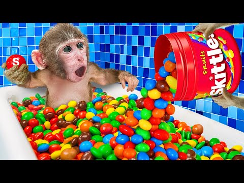 KiKi Monkey bath in Full of Sweet Rainbow Skittles Candy Bathtub in the bathroom |  KUDO ANIMAL KIKI