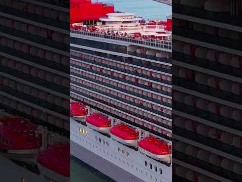 Side view of Virgin Voyages' Scarlet Lady cruise ship