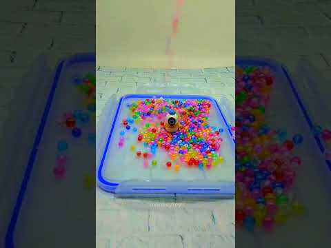 ASMR Minion showered and shaked by colorful beads 05