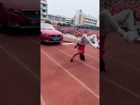 WATCH: Physical education teacher pulls car while walking on hands #shorts