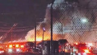 Baltimore firefighters battle large blaze at auto repair shop