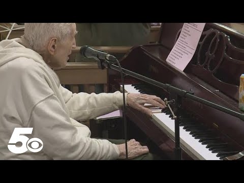 WWII veteran shows off musical skills on 102nd birthday