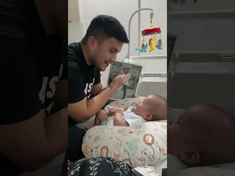 Dad Shows Baby Family Photo