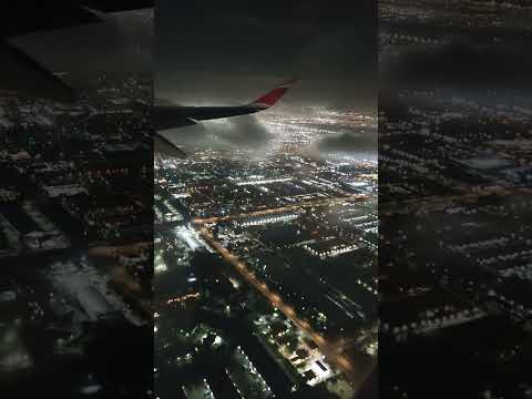 Night Flight from Miami. City aerial view.