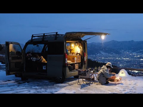 Car camping on a snowy mountain at minus 5 degrees Celsius