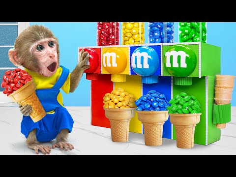 KiKi Monkey discover Sweet Rainbow M&M Candy Dispenser Machine as mechanic | KUDO ANIMAL KIKI