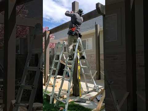 Notching the Tops of Timber Pergola Posts with a Chainsaw | Remodelaholic