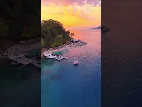 Golden sands meet crystal-clear waters at Fethiye Beach, Turkey