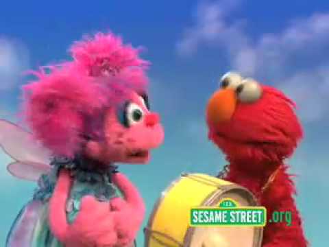 Sesame Street Elmo makes Rhythm with a drum