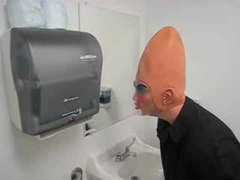 The Conehead is dispensing paper towels