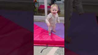 Playful Toddler Gently Tumbles Off Mats