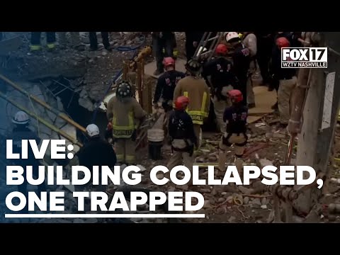 One person is trapped under a structure that has collapsed in Kentucky