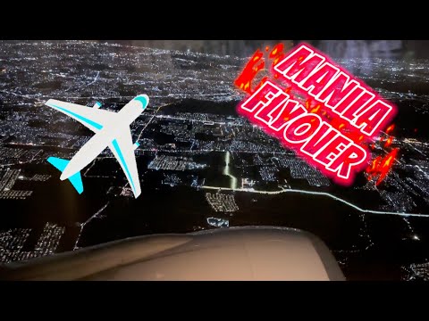 Nighttime view of Manila skyline | Flying from Manila to Los Angeles