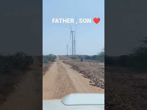 Father, Son Love. Wind Turbines