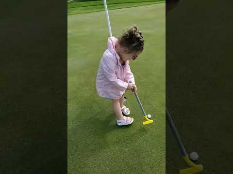 Young Girl Cheats At Golf