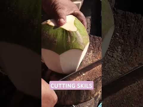 Very impressive coconut cutting skills Asmr #cuttingskills #streetfood #youtubeshorts @GatchieJr33