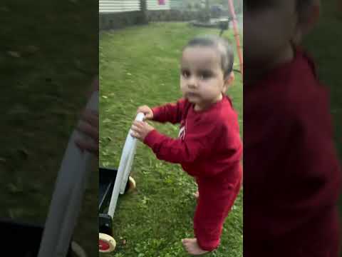 Baby boy try to walk in garden area ￼￼