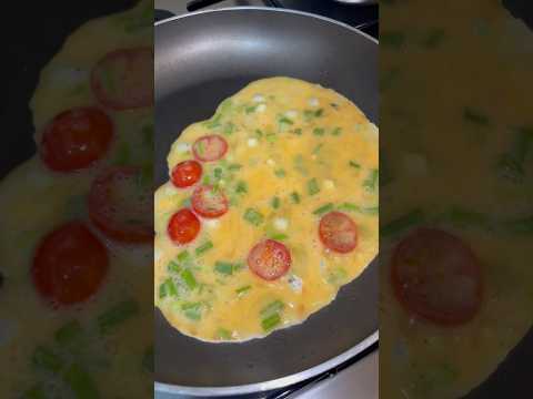 Scrambled eggs with cherry tomatoes &  spring onions