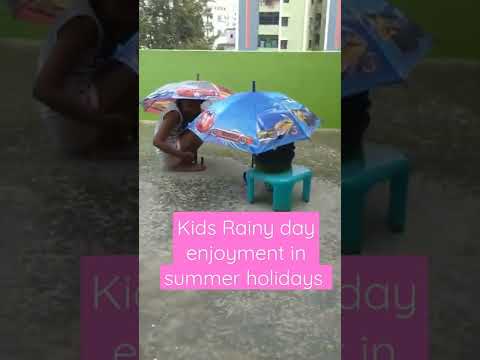 kids enjoying rainy day in summer holidays 10 May 2022