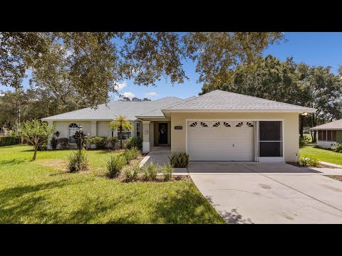 Nice Florida Family Home!   3/2 with real wood floors, custom built ins, large patio over 1/3 acre.