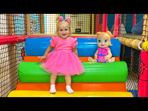 Alice has fun on the indoor playground