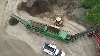 McCloskey 621RE Trommel Screener and Screencore 4100 Stacker - Screening and Stacking Black Dirt!