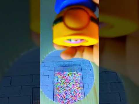 ASMR Minion jumps into colorful beads 14