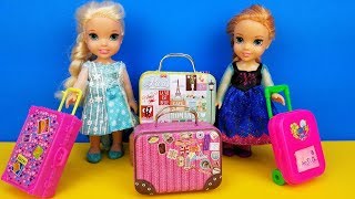 Elsa and Anna toddlers - shopping for luggage - suitcases - Barbie is the seller