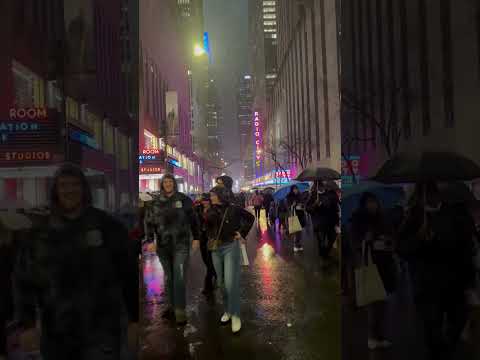 Strolling through rain-kissed nights on NYC's 50th St where colors dance in every drop. #shorts #nyc