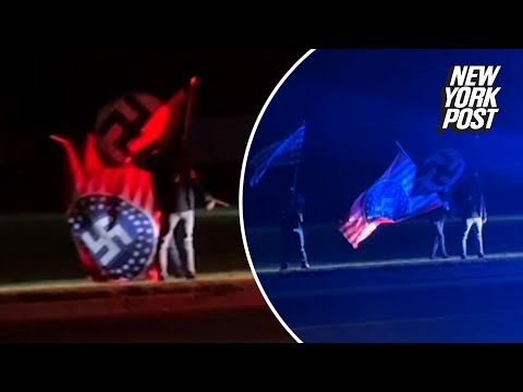 White supremacists caught on camera waving Nazi flags outside Anne Frank play in Michigan