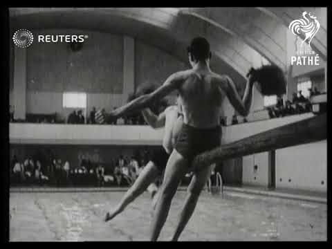 Sailors and members of the Women's Royal Naval Service participate in a swimming competiti...(1941)