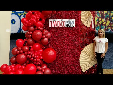 Red Flower Wall With Red Shimmer Wall and Red Balloons For a Flamenco Show