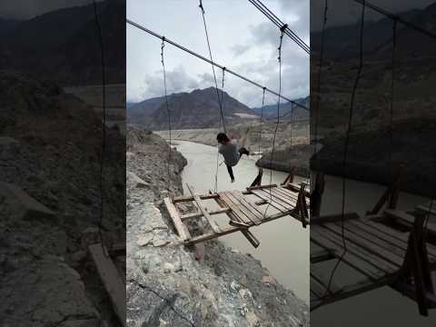 Crossing a DESTROYED bridge in Pakistan