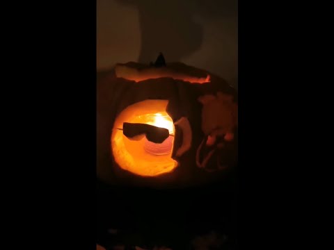 Kiara Showing her Pumpkin Carved with Hololive Mascots