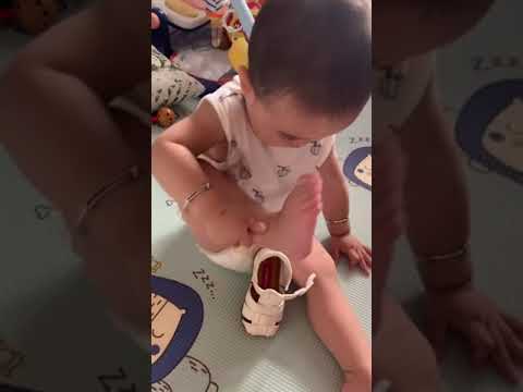 Cute 🥰baby trying wear shoes 👟 #funny #cute #cutebaby #baby #babyfun #viral #entertainment #babylove