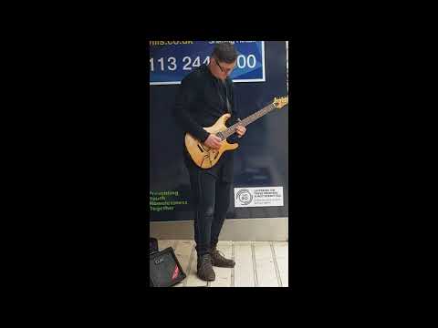 Busker plays Canon Rock on the streets of York