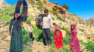 Water piping in the mountains by a nomadic family