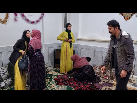 Cultural exchange: Hassan and Parisa with the twins' family | Sewing traditional clothes