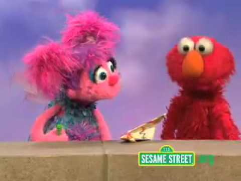 Sesame Street Elmo makes a plane by paper